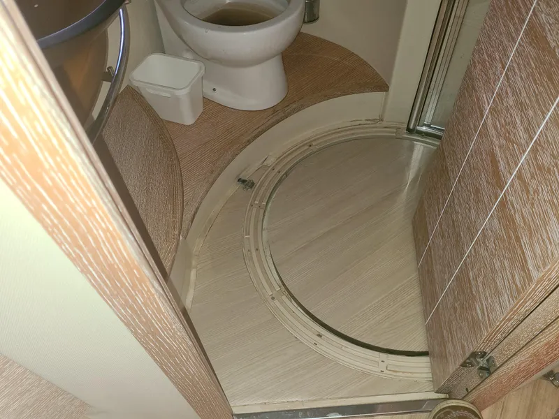 Slide: The Image of Bathroom interior of a 2011 Azimut 47 yacht with toilet and circular shower. - 46