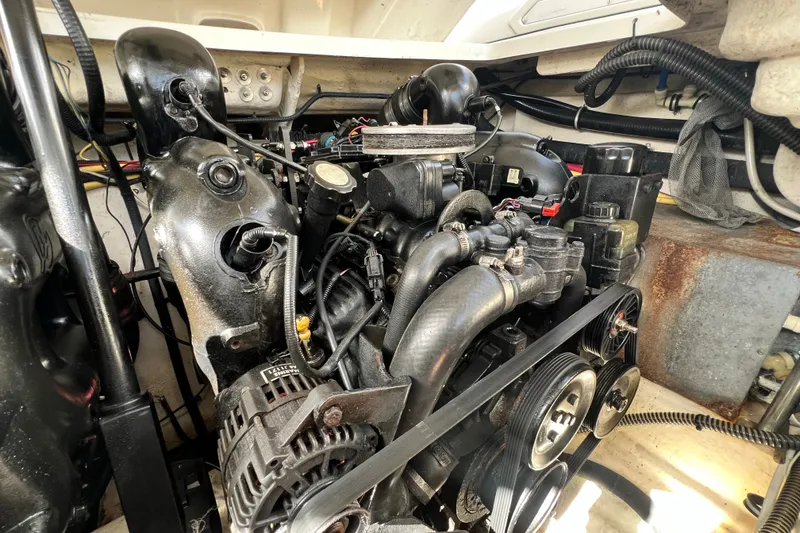 Slide: The Image of Engine compartment of a 2011 Monterey 328SS Super Sport boat, showcasing mechanical components. - 47