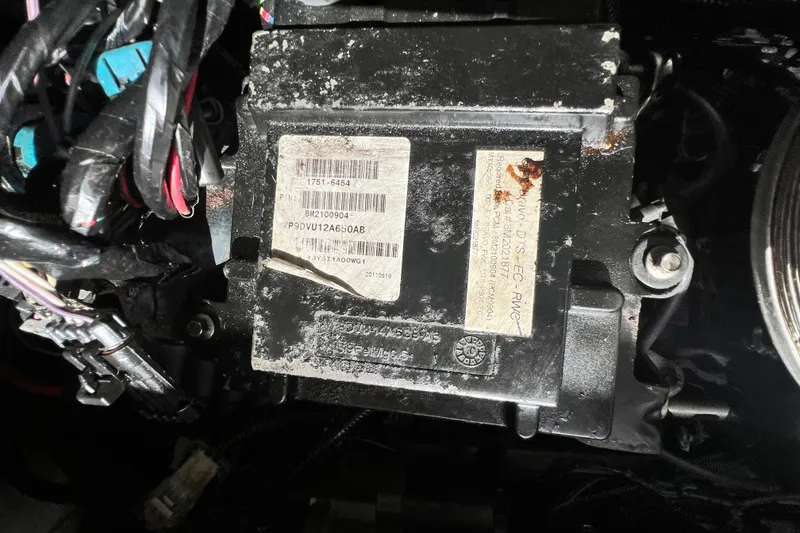 Slide: The Image of Close-up of a 2011 Monterey 328SS Super Sport engine component with wiring and labels. - 50