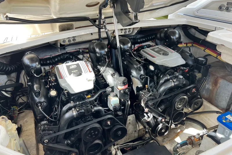 Slide: The Image of Engine compartment of a 2011 Monterey 328SS Super Sport boat, showcasing dual engines. - 42