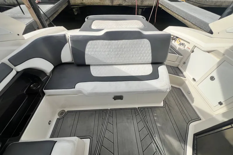 Slide: The Image of 2011 Monterey 328SS Super Sport boat interior with cushioned seating and sleek design. - 28