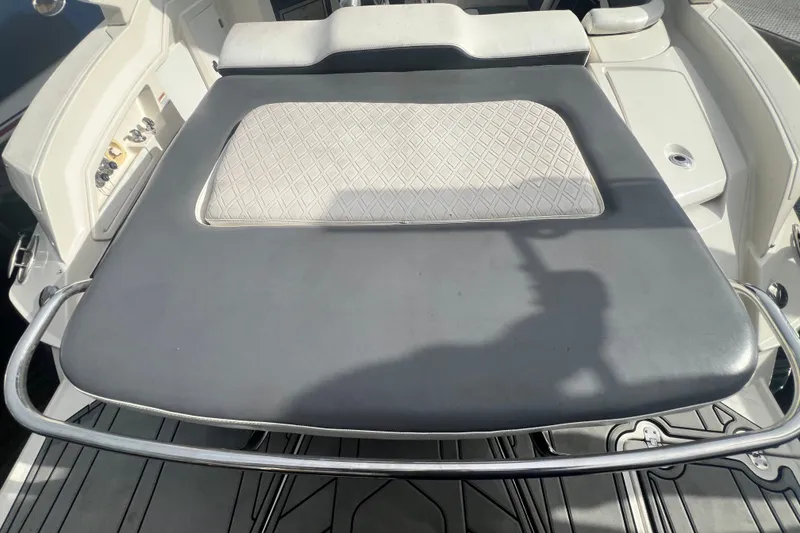 Slide: The Image of 2011 Monterey 328SS Super Sport boat interior with cushioned seating and sleek design. - 23