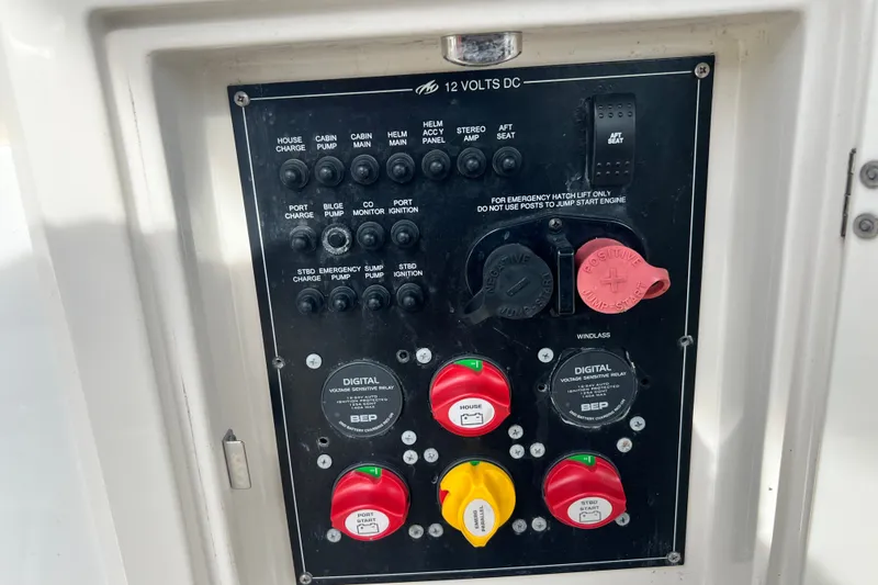 Slide: The Image of Control panel of a 2011 Monterey 328SS Super Sport boat, featuring various switches and dials. - 33
