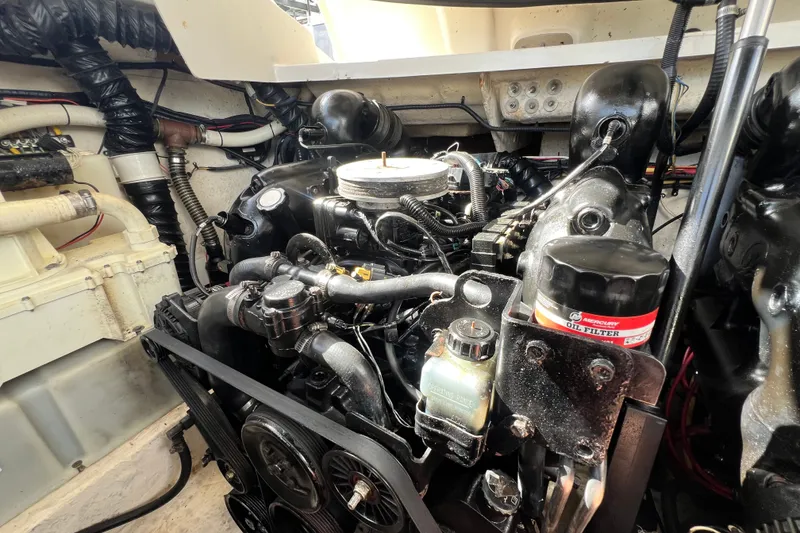 Slide: The Image of Engine compartment of a 2011 Monterey 328SS Super Sport boat, showcasing detailed components. - 49