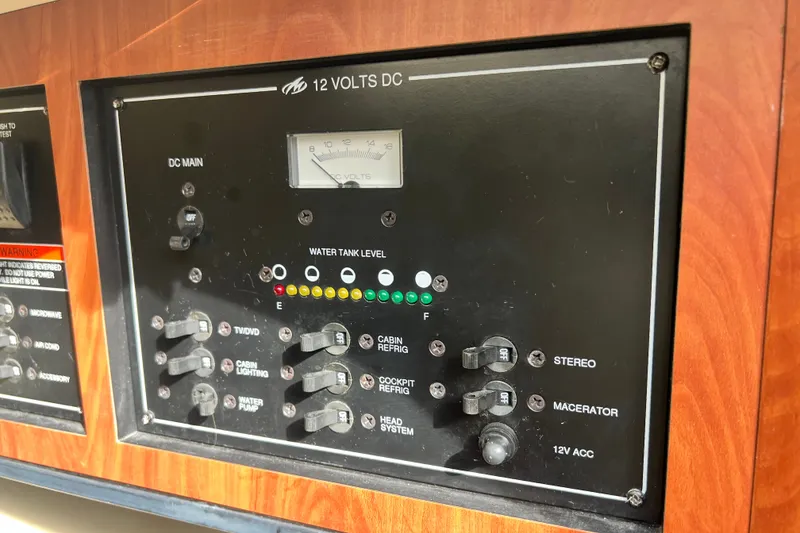 Slide: The Image of Control panel of a 2011 Monterey 328SS Super Sport boat, featuring switches and gauges. - 40