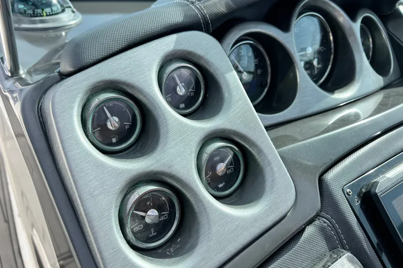 Slide: The Image of Close-up of a 2011 Monterey 328SS Super Sport dashboard with multiple gauges. - 31