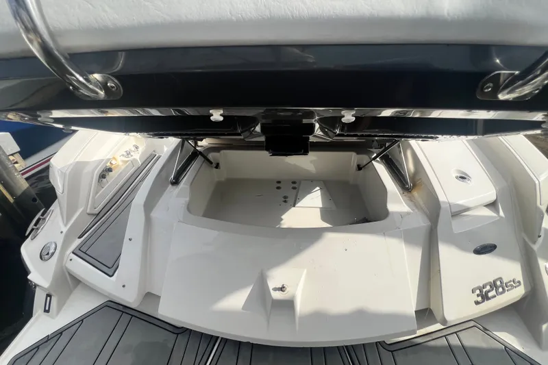 Slide: The Image of 2011 Monterey 328SS Super Sport boat interior with open storage compartment. - 22