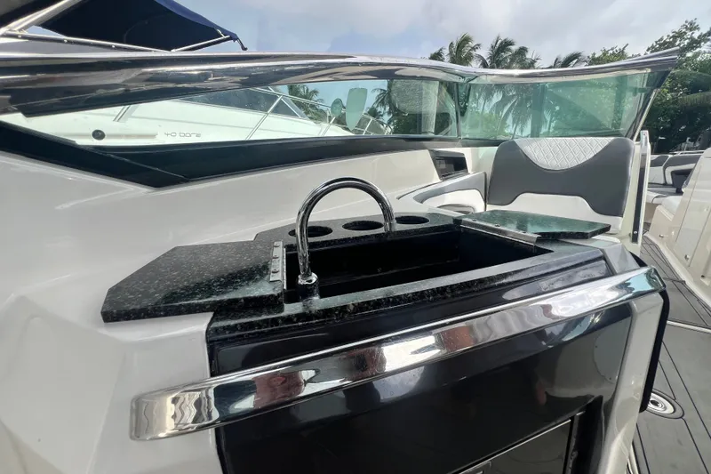 Slide: The Image of Luxury interior of 2011 Monterey 328SS Super Sport boat with sleek sink and seating. - 30