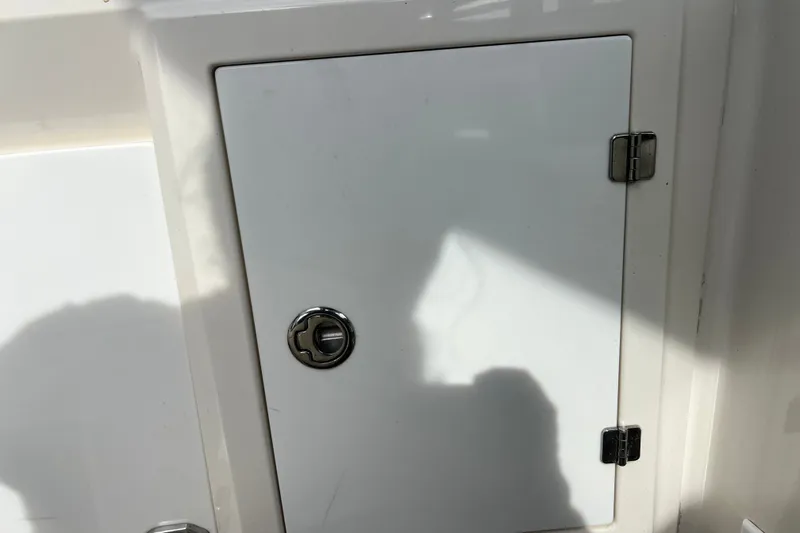 Slide: The Image of White compartment door on a 2011 Monterey 328SS Super Sport boat. - 32