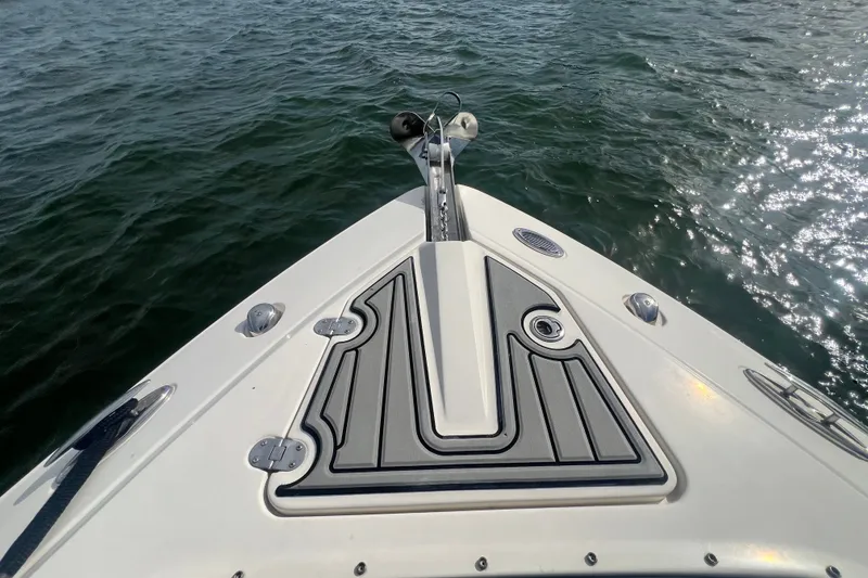 Slide: The Image of Bow of 2011 Monterey 328SS Super Sport boat on water. - 16
