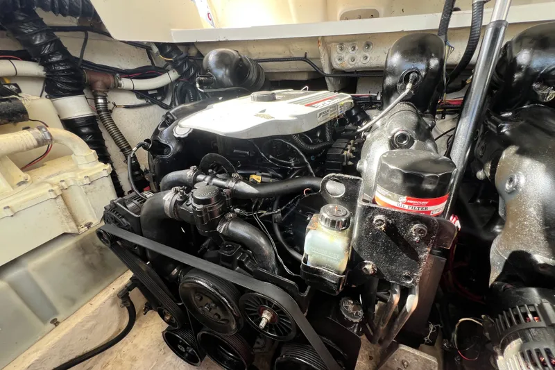 Slide: The Image of Engine compartment of a 2011 Monterey 328SS Super Sport boat, showcasing detailed components. - 48