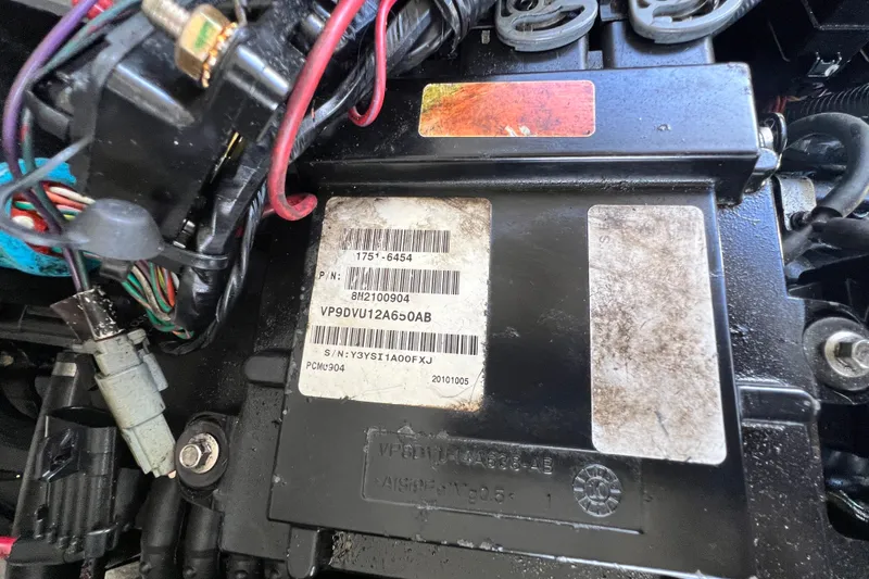 Slide: The Image of Close-up of a 2011 Monterey 328SS Super Sport engine component with wiring and labels. - 46