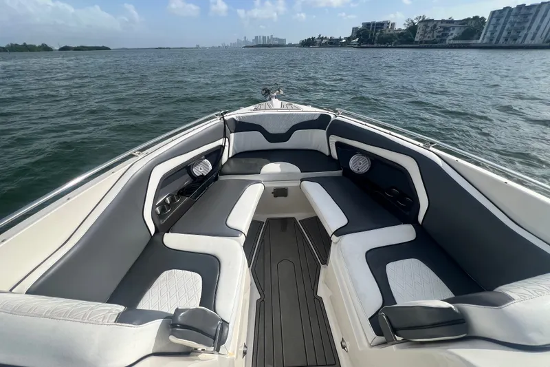 Slide: The Image of 2011 Monterey 328SS Super Sport boat interior with stylish seating on open water. - 13