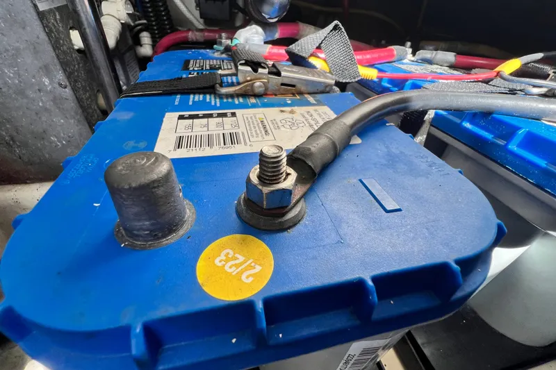 Slide: The Image of Close-up of a blue battery in a 2011 Monterey 328SS Super Sport boat. - 51