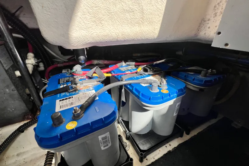 Slide: The Image of Battery compartment of a 2011 Monterey 328SS Super Sport boat with blue-top batteries. - 52
