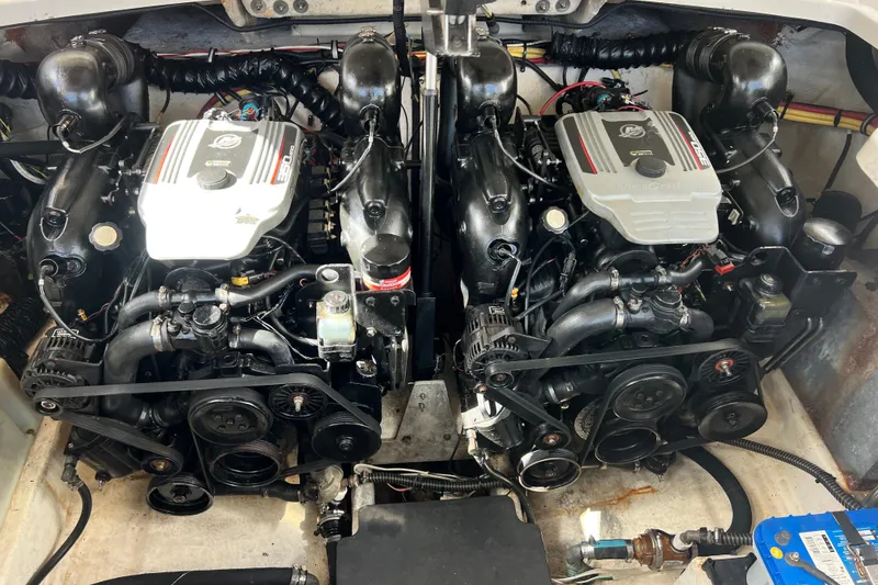 Slide: The Image of Engine compartment of a 2011 Monterey 328SS Super Sport boat, featuring dual engines. - 41