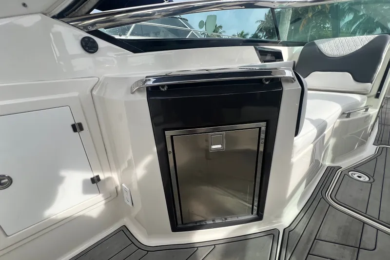Slide: The Image of 2011 Monterey 328SS Super Sport boat interior with sleek seating and built-in storage. - 29