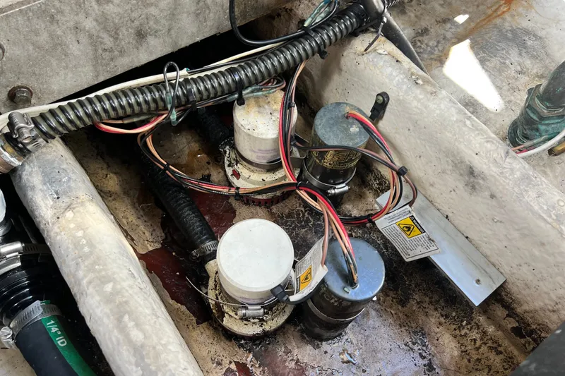 Slide: The Image of Bilge area of 2011 Monterey 328SS Super Sport with wiring and pumps visible. - 53