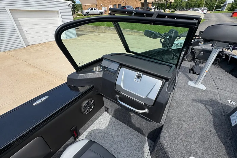Slide: The Image of 2025 Lund 1875 Pro-V boat interior with modern dashboard and seating. - 28