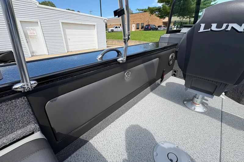 Slide: The Image of 2025 Lund 1875 Pro-V boat interior with sleek seating and modern design. - 35