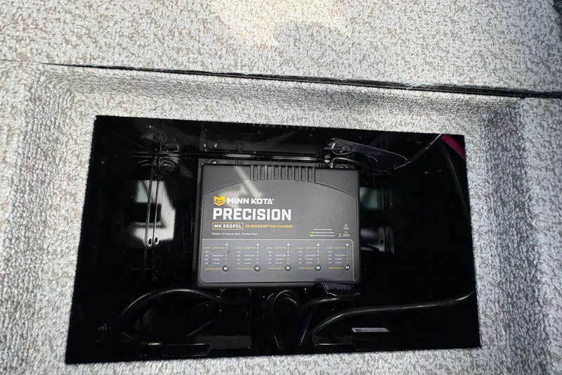 Slide: The Image of Minn Kota Precision charger in 2025 Lund 1875 Pro-V boat compartment. - 20