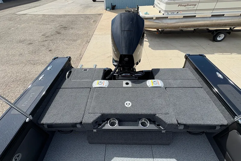 Slide: The Image of 2025 Lund 1875 Pro-V boat with outboard motor, featuring spacious deck and storage compartments. - 40