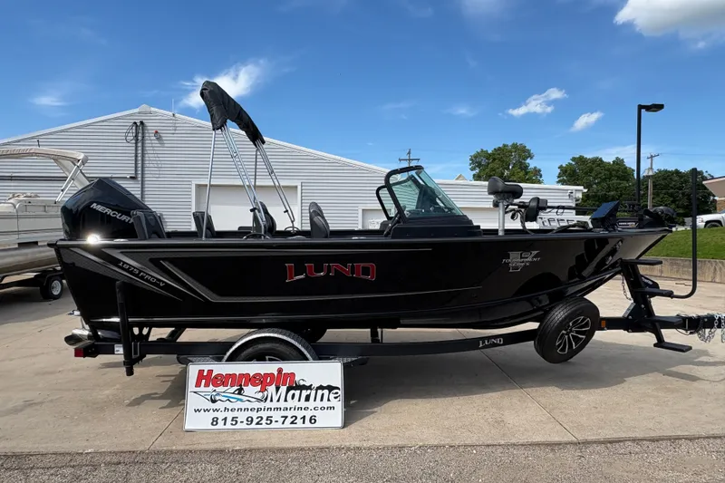 The Image of 2025 Lund 1875 Pro-V boat on trailer at Hennepin Marine dealership. - 1