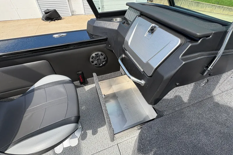 Slide: The Image of 2025 Lund 1875 Pro-V boat interior with storage compartment and seating. - 30