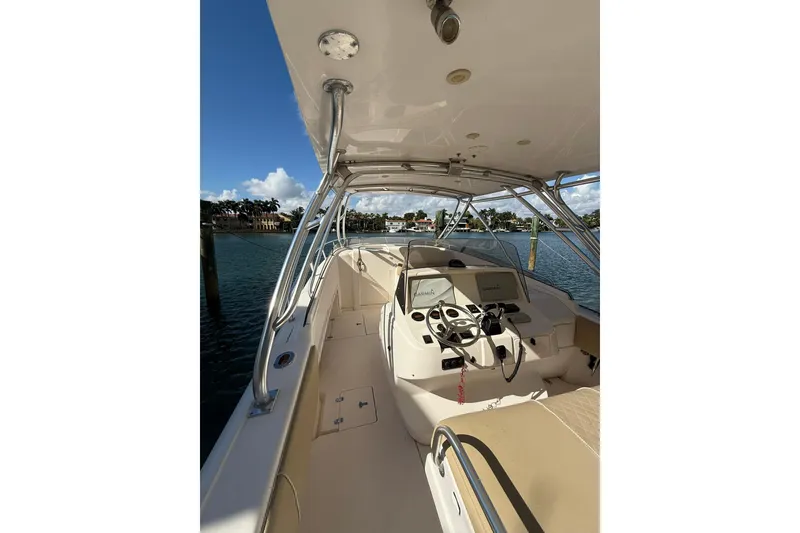 Slide: The Image of 2008 Intrepid 370 Cuddy boat interior with helm, steering wheel, and navigation equipment. - 26