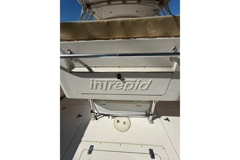 Slide: The Image of 2008 Intrepid 370 Cuddy boat interior with branded storage compartment. - 11