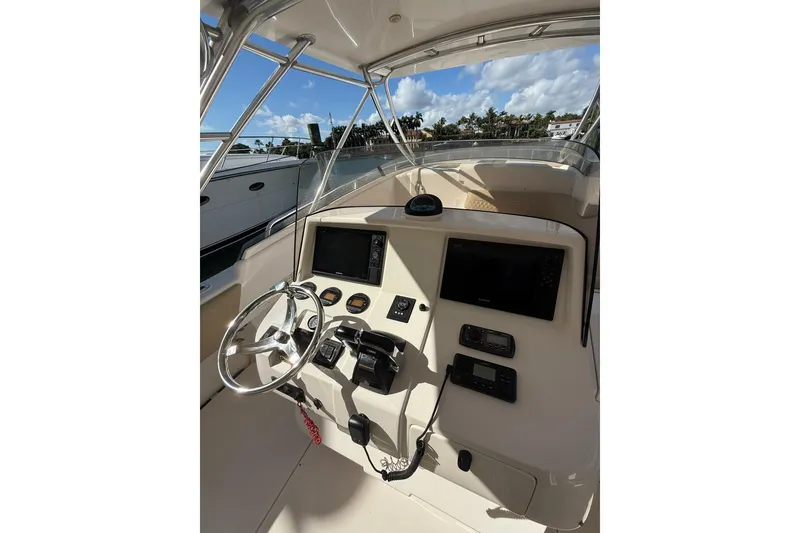 Slide: The Image of 2008 Intrepid 370 Cuddy helm with steering wheel and navigation equipment. - 16