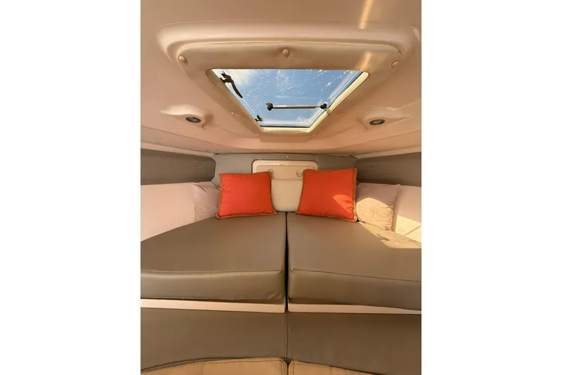 Slide: The Image of Interior of 2008 Intrepid 370 Cuddy with skylight and orange cushions. - 51