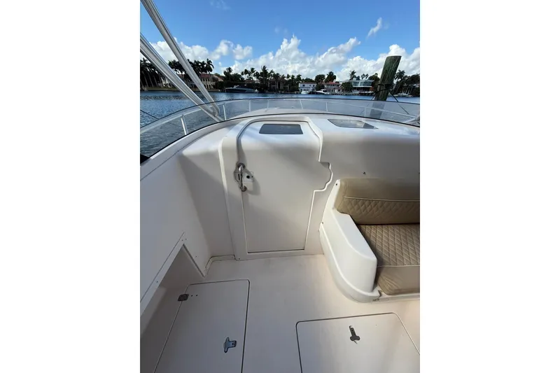 Slide: The Image of 2008 Intrepid 370 Cuddy boat interior with seating and storage compartments. - 44