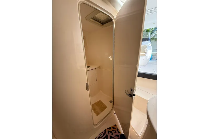 Slide: The Image of 2008 Intrepid 370 Cuddy cabin interior with open door, showcasing compact design. - 56
