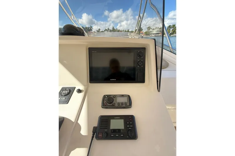 Slide: The Image of Control panel of a 2008 Intrepid 370 Cuddy with Garmin navigation system. - 17