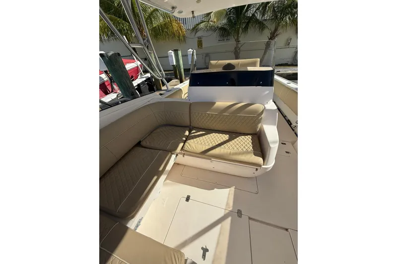 Slide: The Image of 2008 Intrepid 370 Cuddy boat interior with beige seating and sleek design. - 34