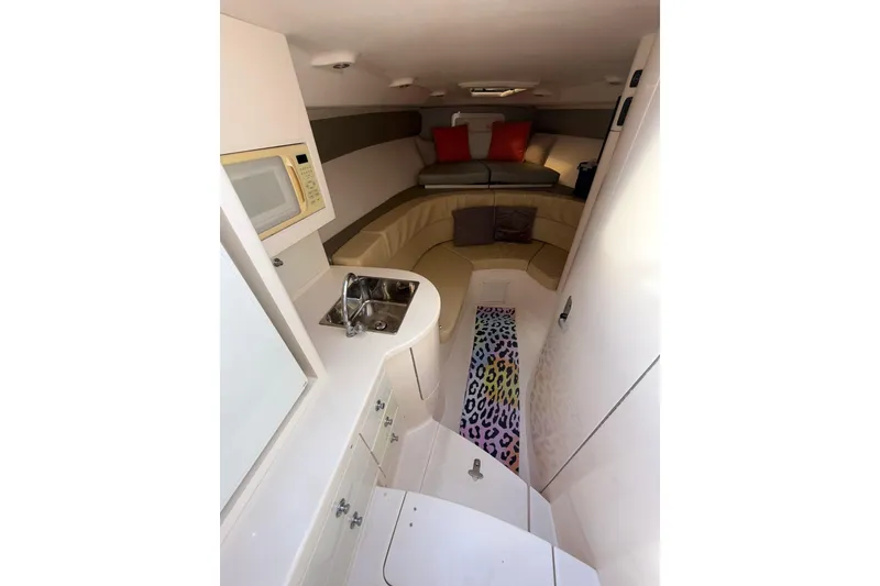 Slide: The Image of Interior of 2008 Intrepid 370 Cuddy boat with cozy seating and kitchenette. - 47