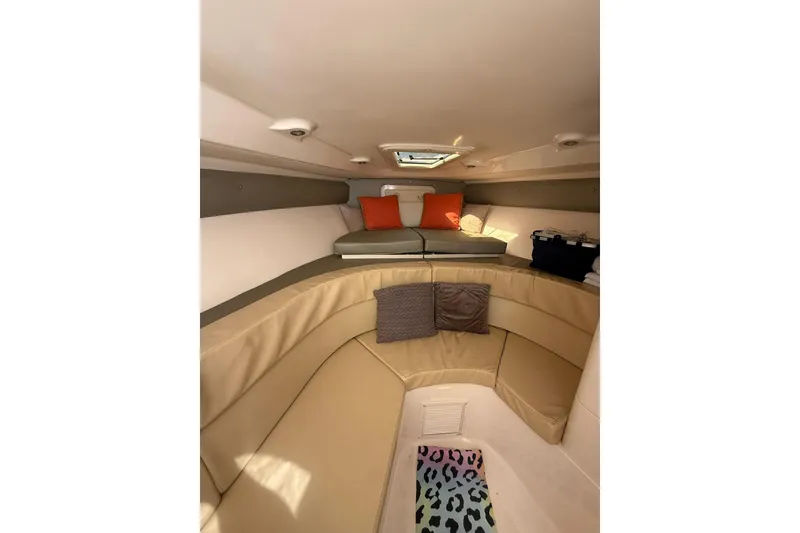 Slide: The Image of 2008 Intrepid 370 Cuddy cabin interior with beige seating and colorful accents. - 49