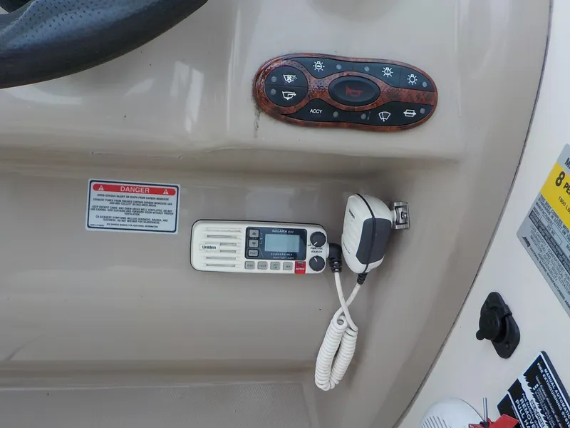 Slide: The Image of Close-up of the helm with controls and a radio unit. - 15