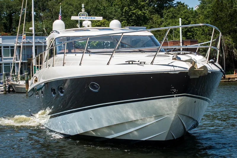 Slide: The Image of 2008 Princess V58 yacht cruising on a sunny day, showcasing sleek design and luxury. - 1
