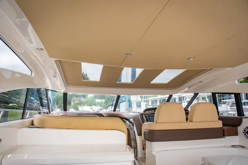 Slide: The Image of Interior of 2008 Princess V58 yacht with beige seating and panoramic windows. - 14
