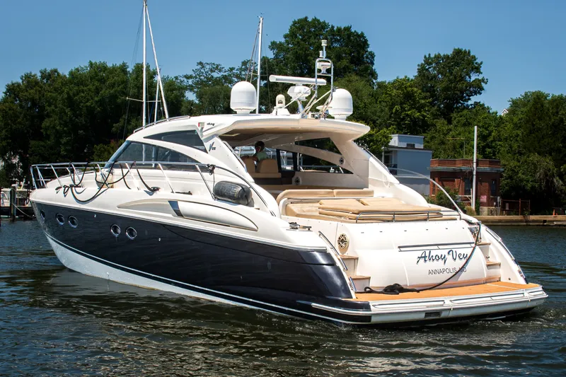 Slide: The Image of 2008 Princess V58 yacht on water, featuring sleek design and luxurious amenities. - 2