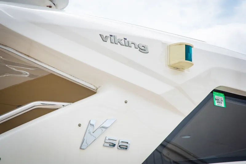 Slide: The Image of Close-up of a 2008 Princess V58 yacht with Viking branding. - 15