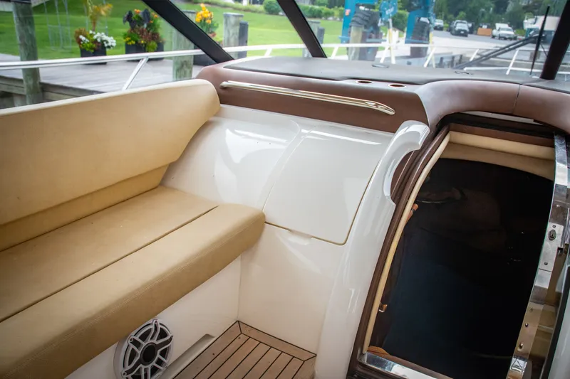 Slide: The Image of Interior of 2008 Princess V58 yacht with beige seating and wooden flooring. - 13