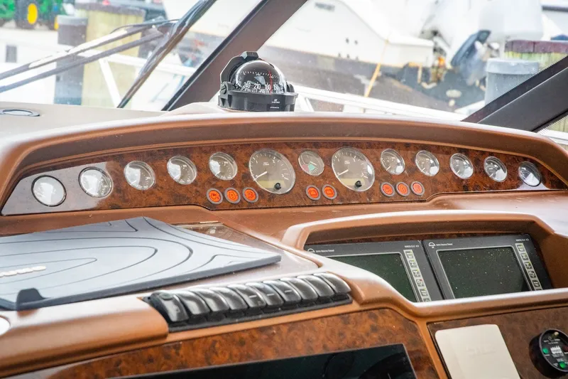 Slide: The Image of Dashboard of a 2008 Princess V58 yacht with gauges and navigation screens. - 7