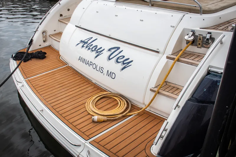 Slide: The Image of 2008 Princess V58 yacht stern with "Ahoy Vey" name, docked in Annapolis, MD. - 10