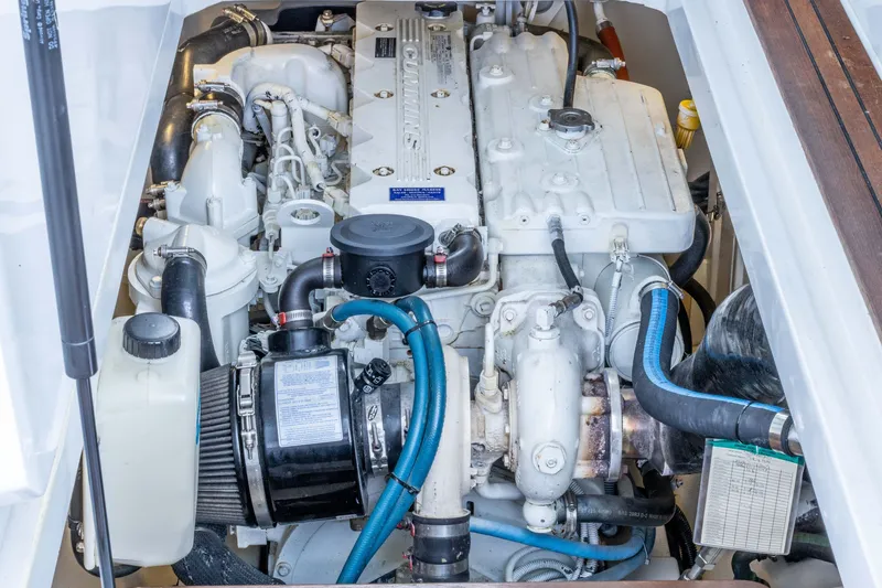 Slide: The Image of Engine compartment of a 2007 Legacy 32 Express boat, showcasing detailed mechanical components. - 16