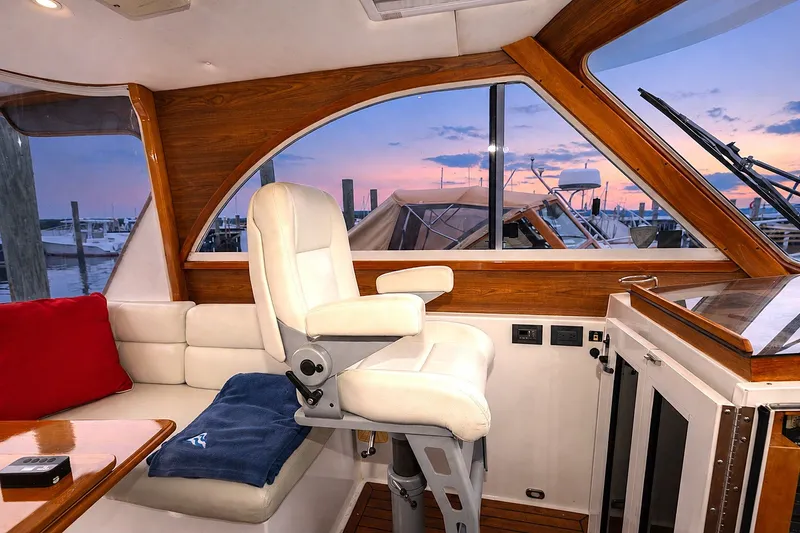 Slide: The Image of Interior of 2007 Legacy 32 Express yacht with sunset view through windows. - 12