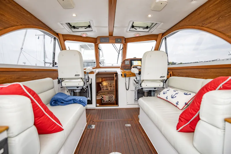 Slide: The Image of Luxurious interior of 2007 Legacy 32 Express yacht with plush seating and nautical decor. - 3