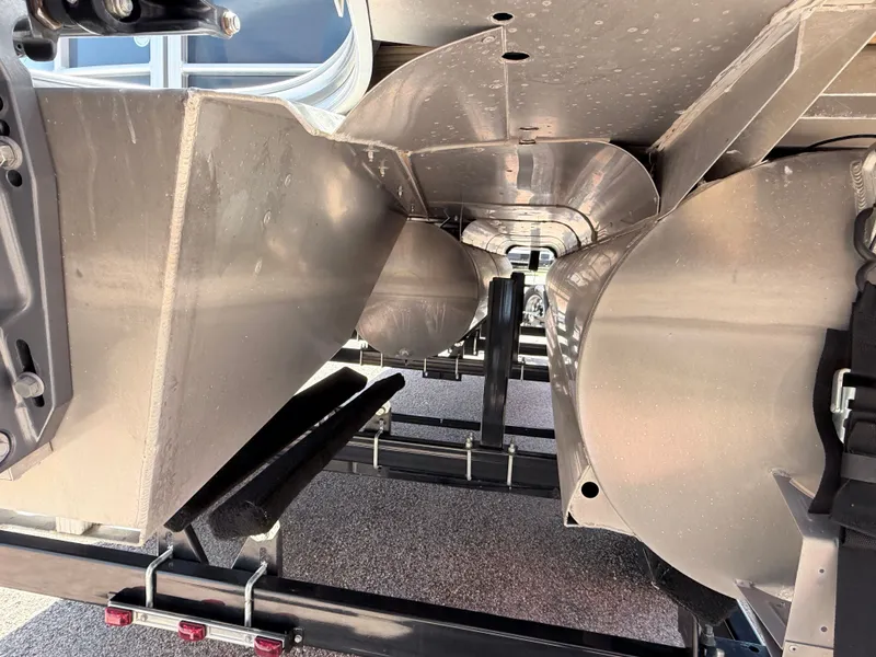 Slide: The Image of Underside view of a Trifecta pontoon boat with aluminum hulls and a trailer. - 7